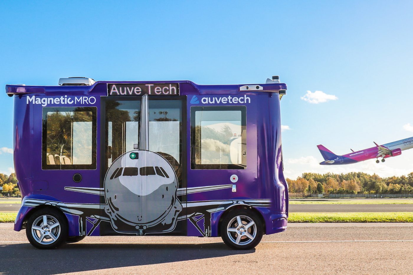 An Auve Tech MiCa autonomous shuttle on the airside at Tallinn Airport in 2026.
