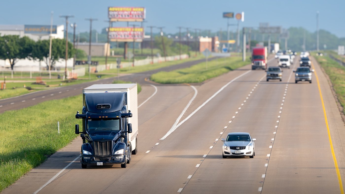 An Aurora self-driving truck on a divided highway, in a press image published by Aurora.