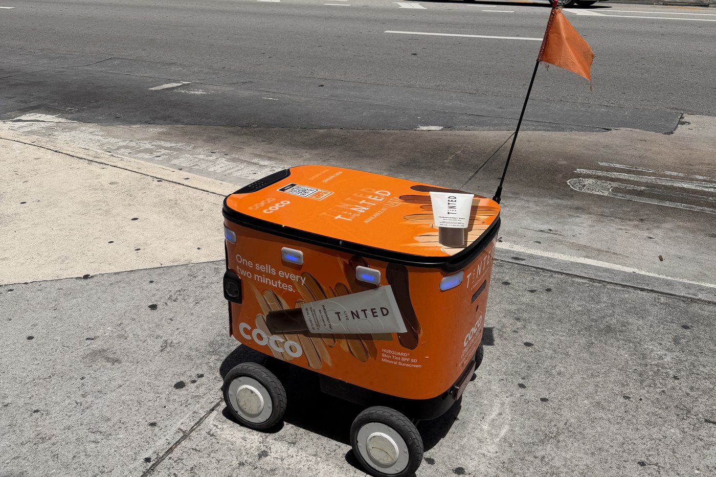 A Coco delivery robot on a sidewalk in the Brickell neighborhood of Miami in April 2026. File photo.