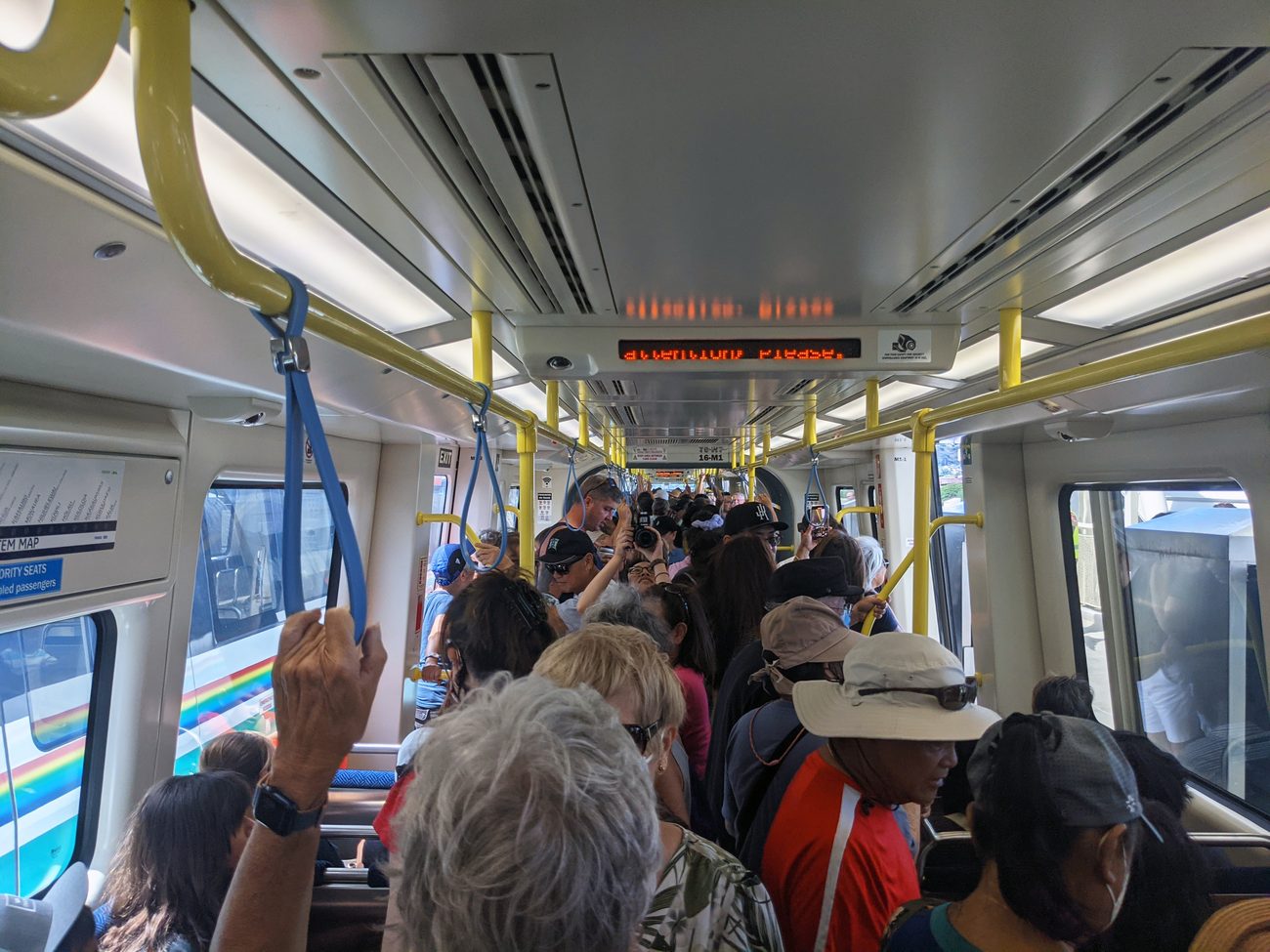 Passengers fill the aisle of a Skyline train on the system's opening day in Honolulu, 30 June 2023.