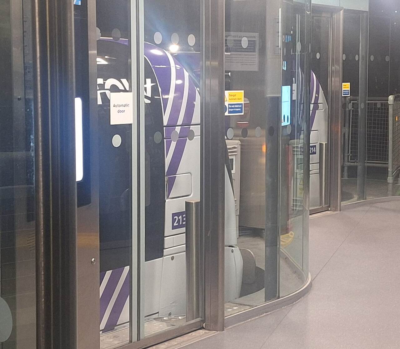A Heathrow pod behind automatic platform screen doors.