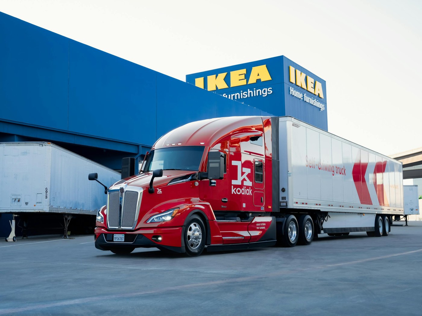 A Kodiak autonomous truck parked outside an IKEA store.
