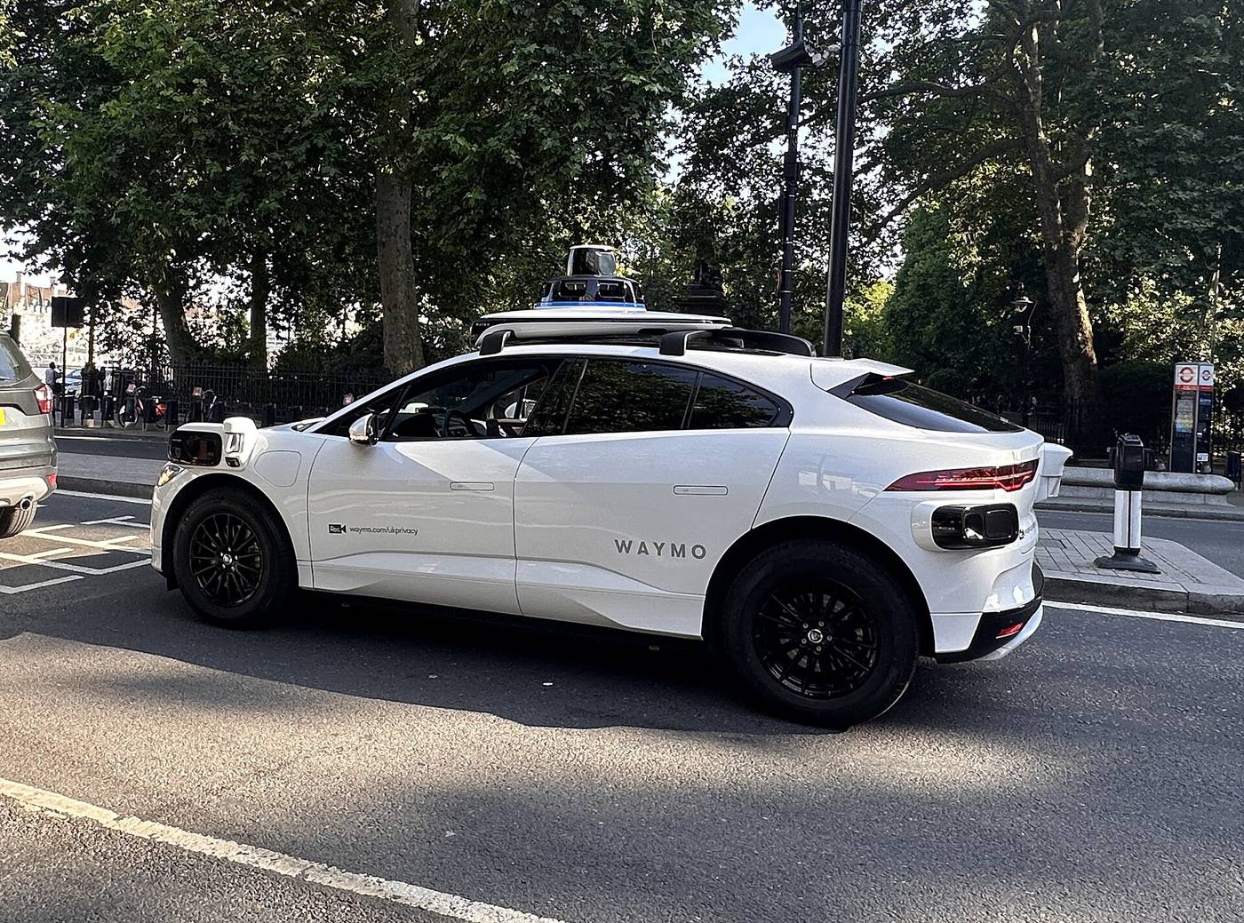 A white Waymo Jaguar I-Pace test vehicle with roof-mounted sensors on Northumberland Avenue in central London in June 2026. File photo.