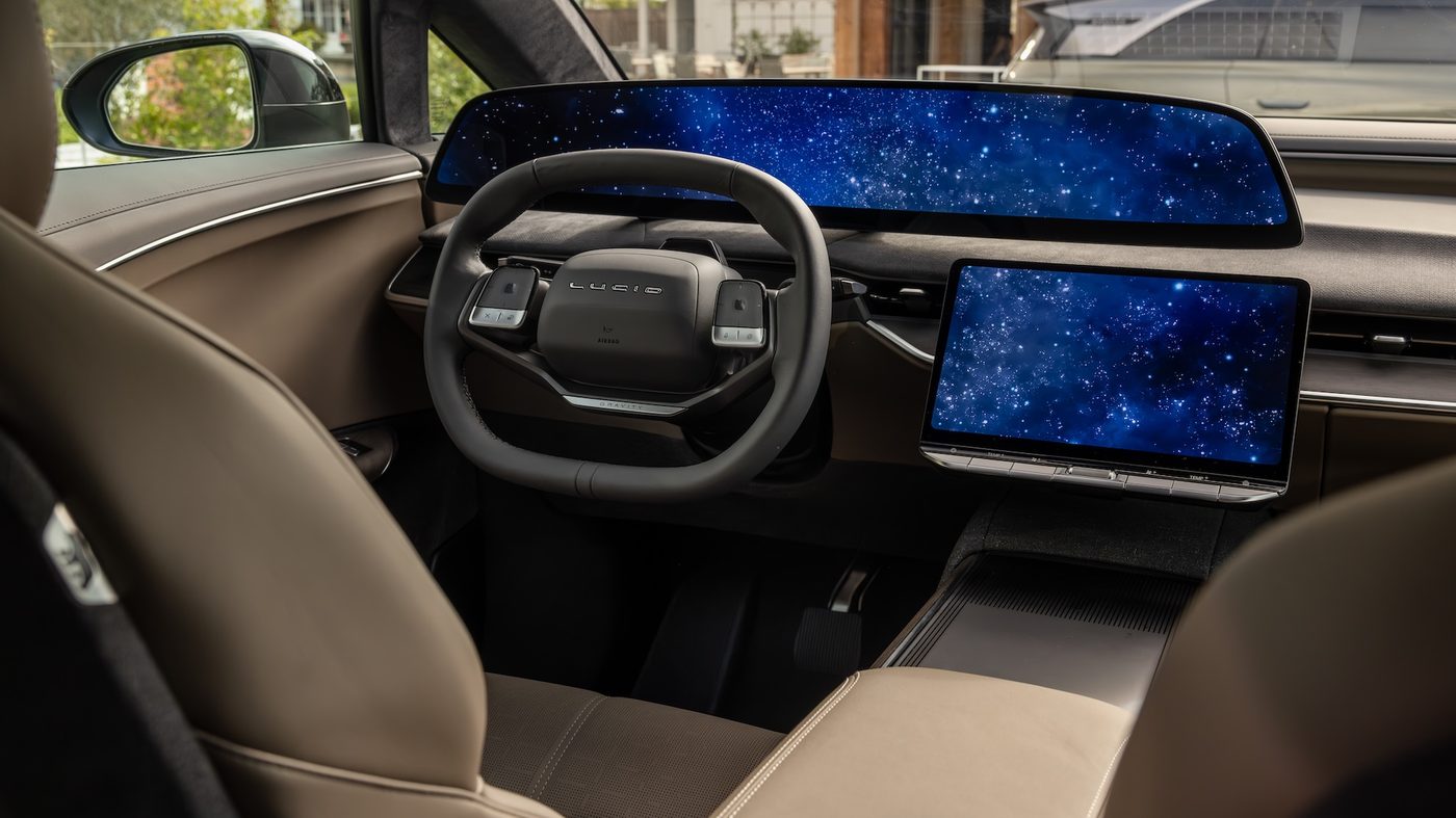 Lucid Gravity interior with steering wheel and dual displays.