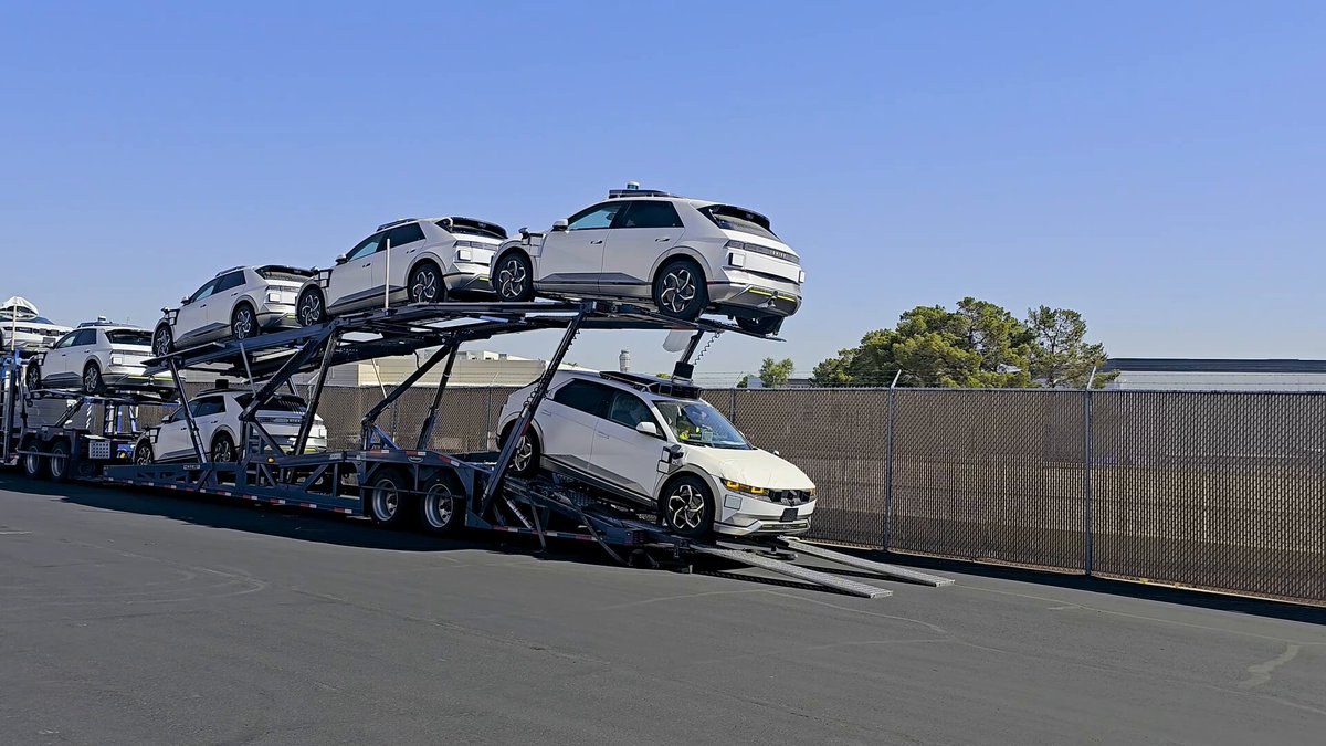 Motional IONIQ 5 robotaxis being unloaded from a car carrier.