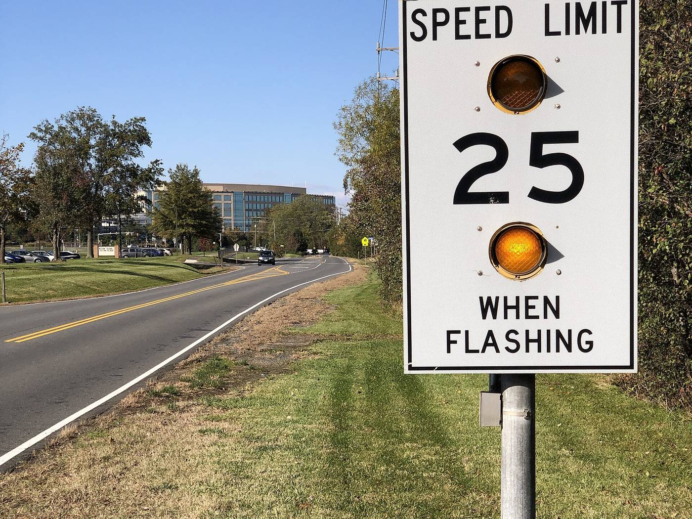 A "Speed Limit 25 When Flashing" school zone sign with amber warning lights in Fairfax County, Va. File photo.