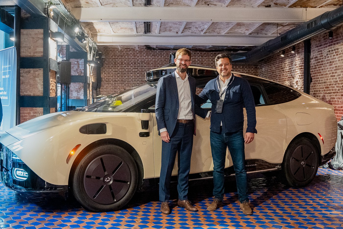 Gregor Beiner, chief executive of Münchner Taxi Zentrum, left, and Hugo Fozzati, chief business officer of Tensor, with the Tensor Robocar at the Madrid Autonomous Mobility Summit.