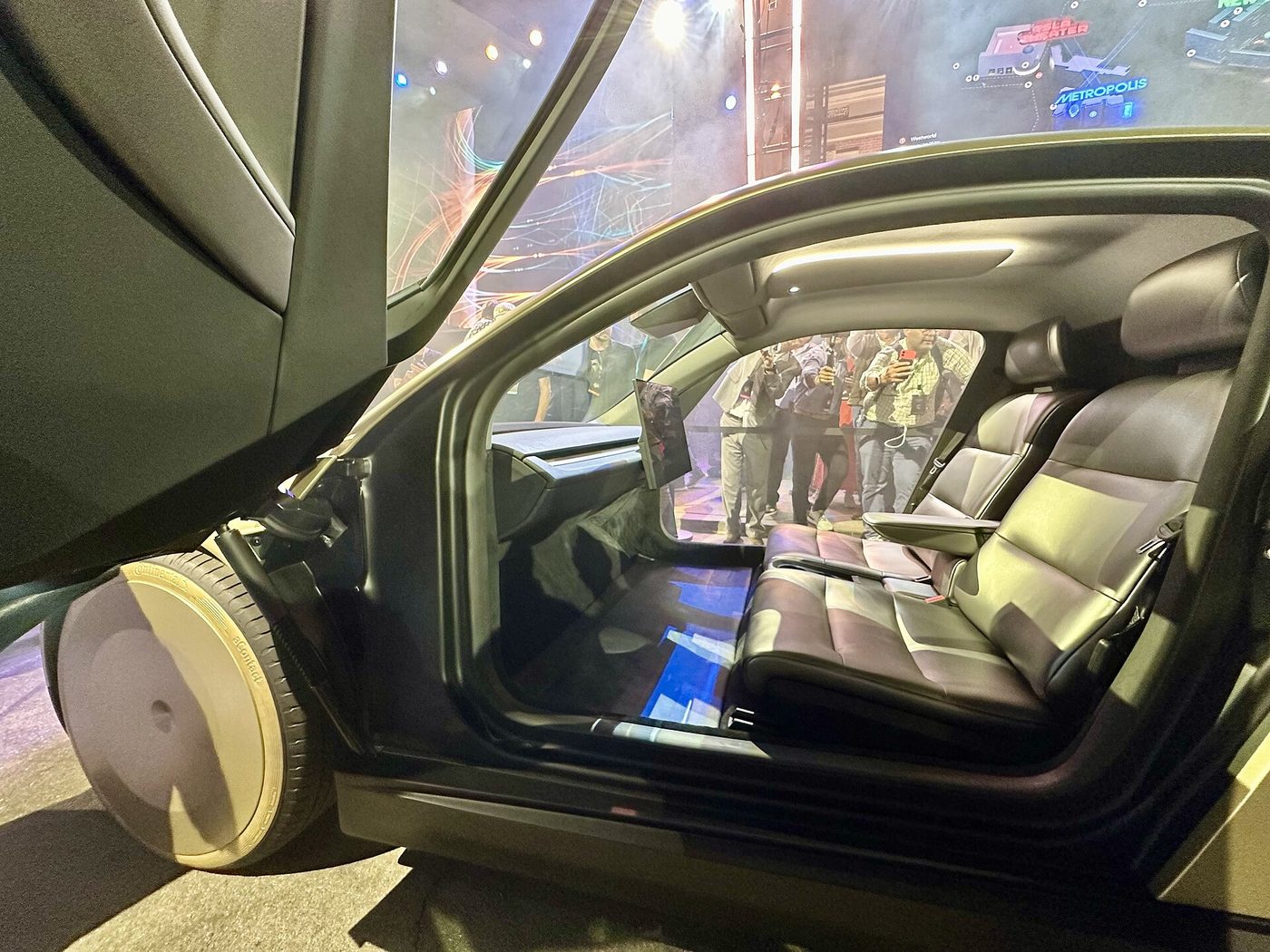 The two-seat cabin of a Tesla Cybercab, with no steering wheel or pedals, at the WeRobot unveiling in October 2024.