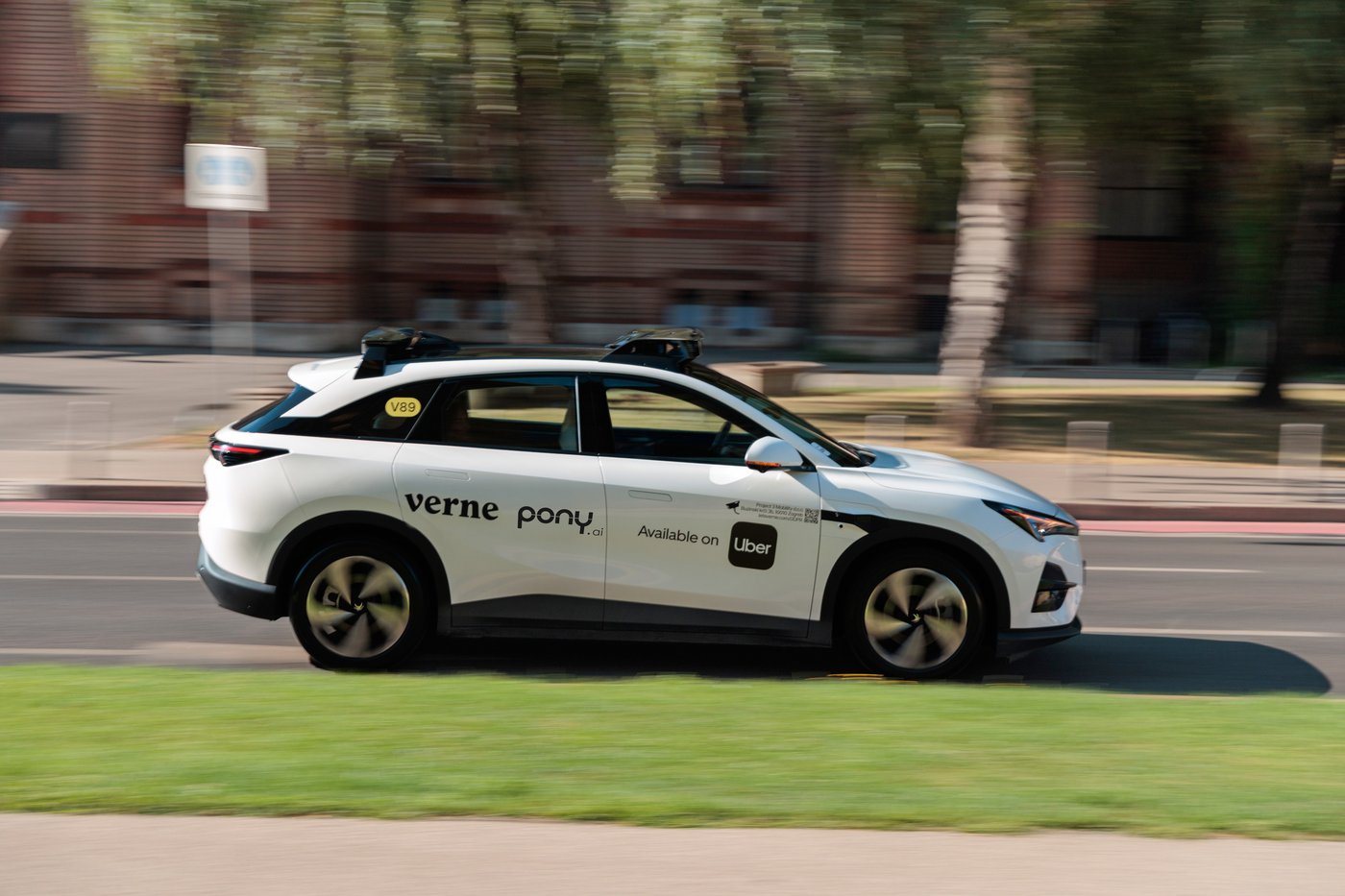 A Verne robotaxi carrying Pony.ai and Uber branding drives along a street in Zagreb.