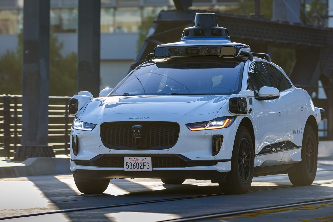 A Waymo Jaguar I-Pace robotaxi crosses the 4th Street Bridge in San Francisco in May 2025. File photo.