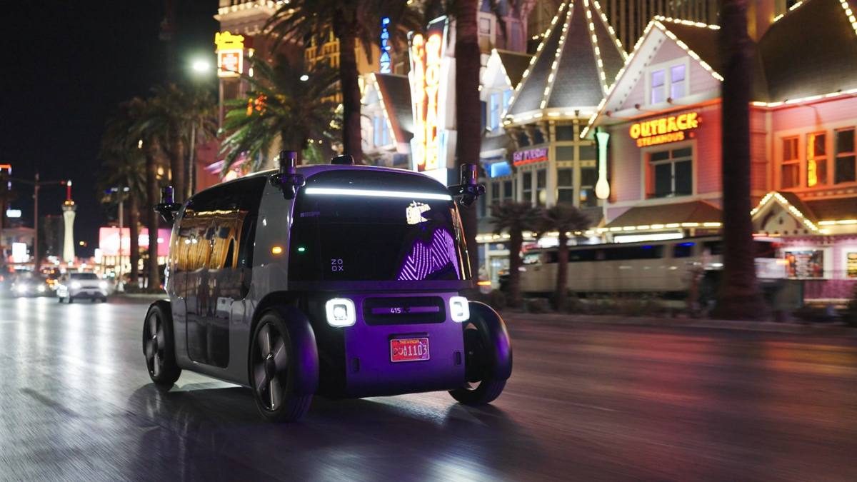 A Zoox robotaxi on the Las Vegas Strip at night.